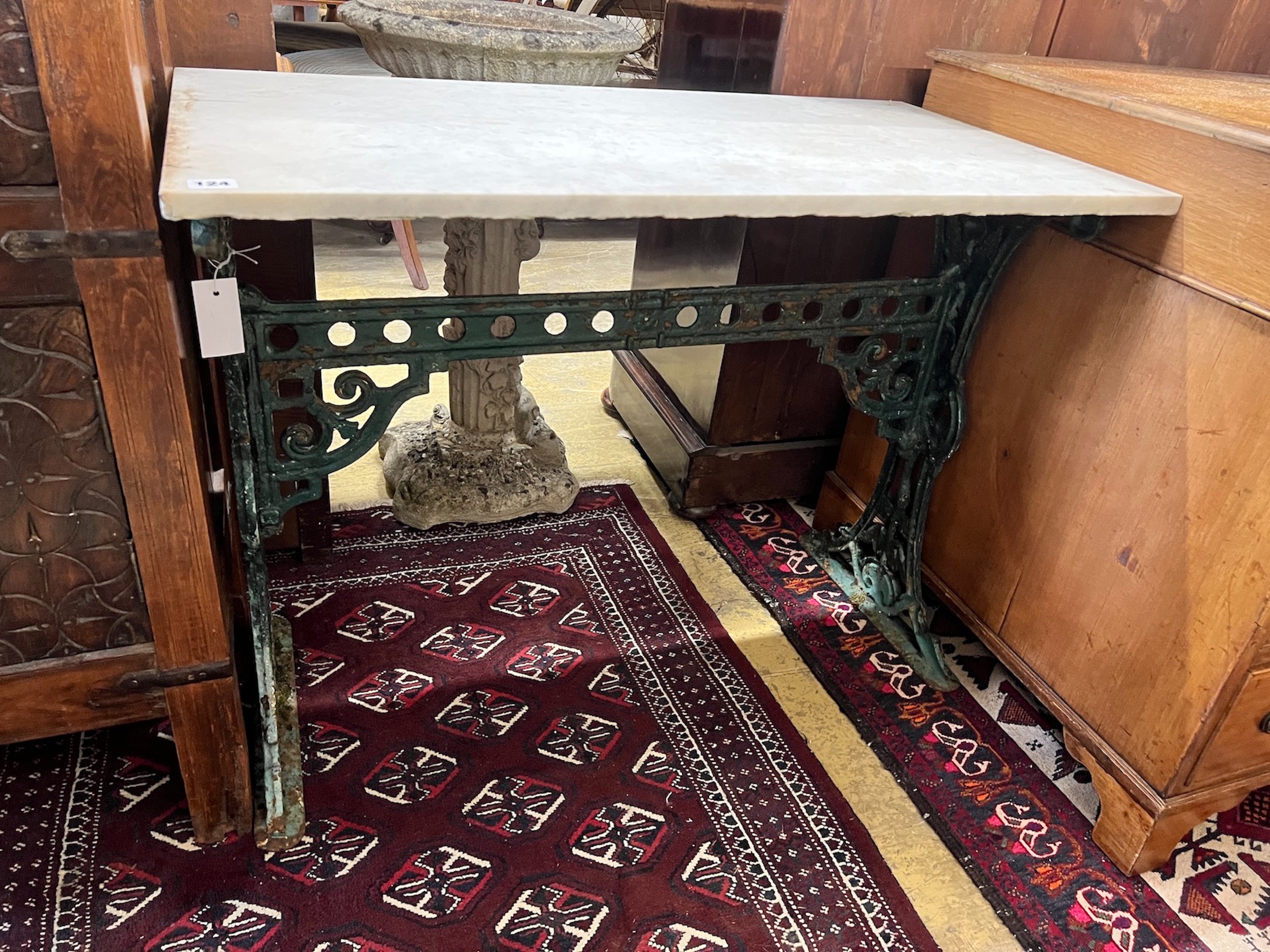 A rectangular marble top cast iron garden table, length 91cm, width 48cm, height 70cm